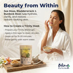 Woman applying a Trinity Mask with Sea Moss, Bladderwrack, and Burdock Root ingredients on a white background.